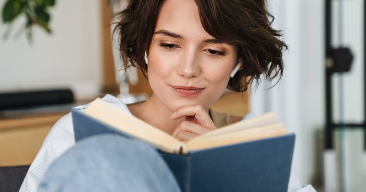 Business communications book image featuring woman reading a book