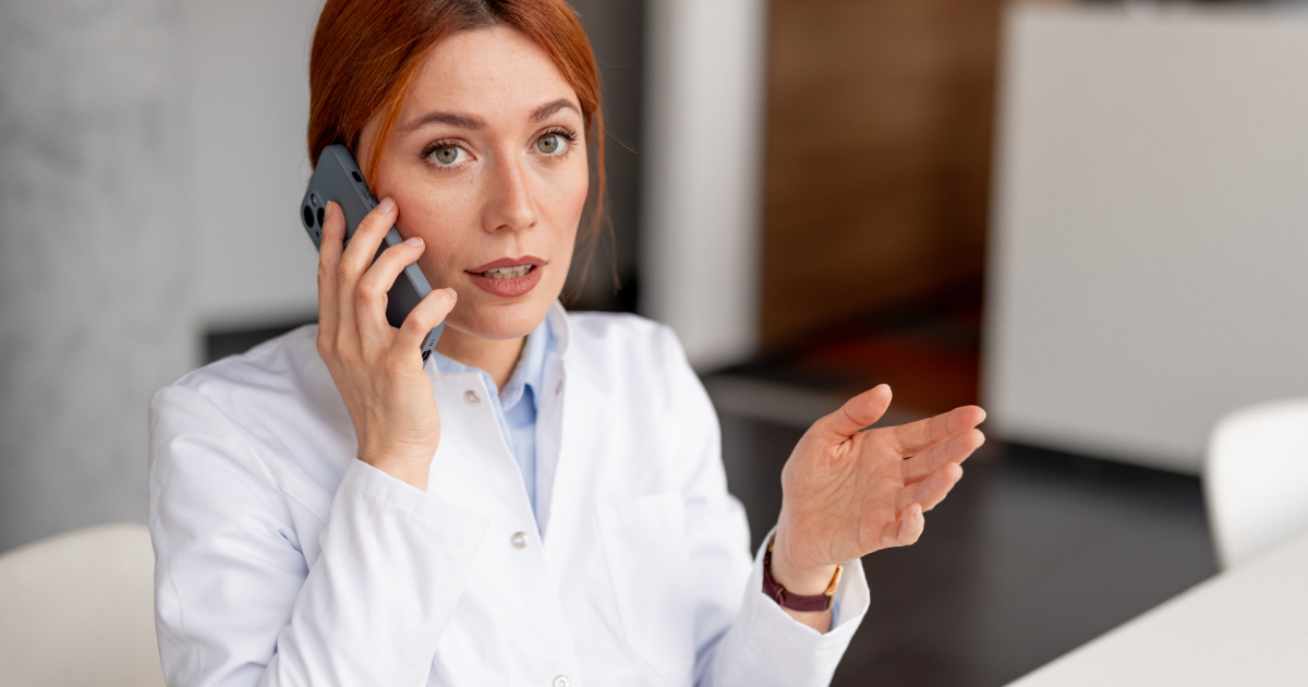 Emergency Notification for Business image featuring employee on phone