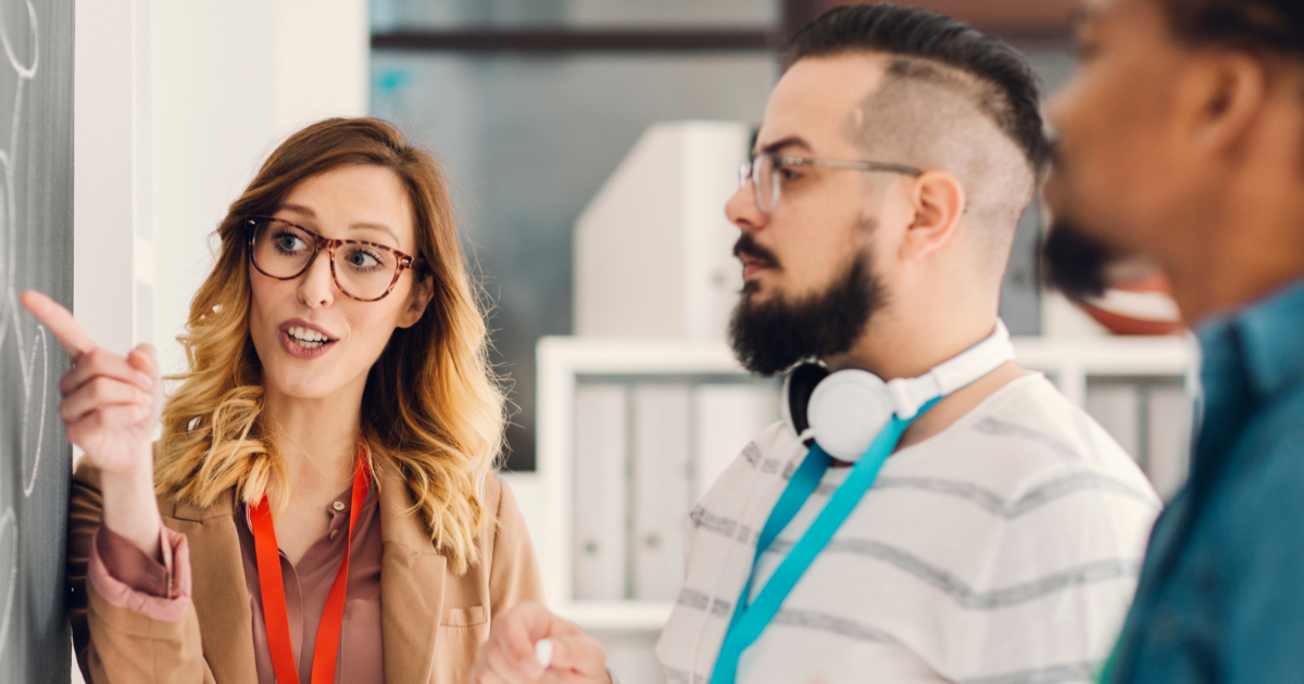 Man and woman working on change management strategies in an office