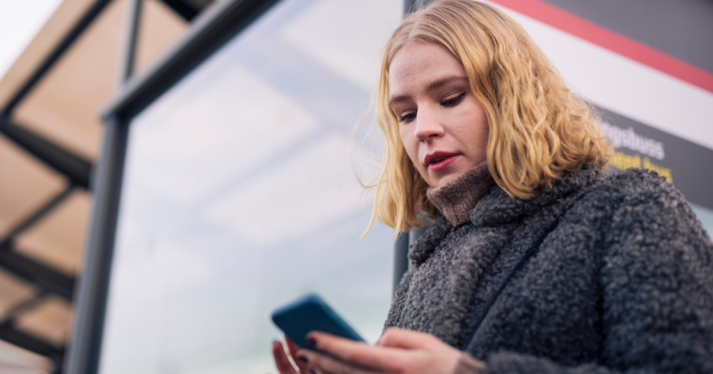 Emergency Notification for Business image featuring employee on phone