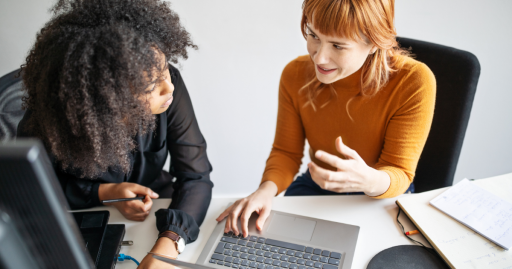 employee newsletter names image featuring a woman on a deviceemployee newsletter names image featuring two women at work