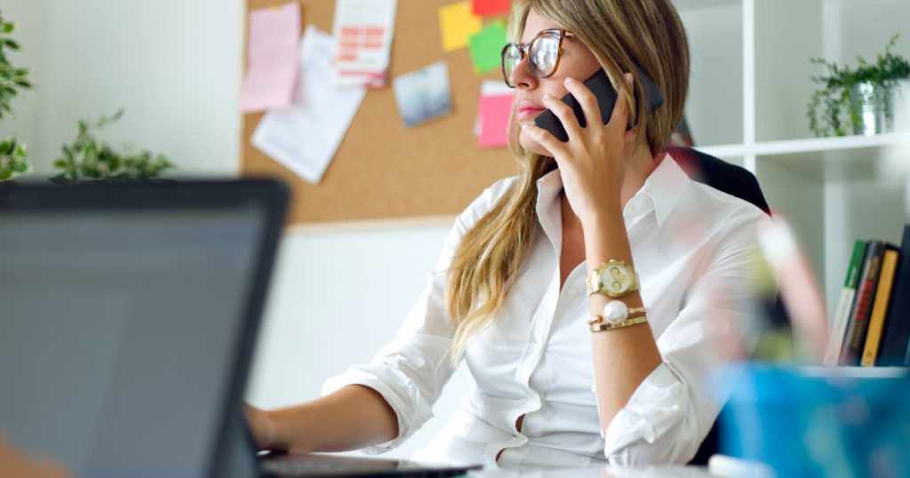 Emergency Notification for Business image featuring employee on phone