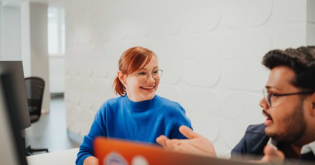 Staffbase employees talking happily
