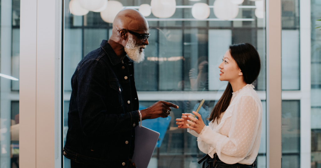 employee communication image featuring two coworkers talking