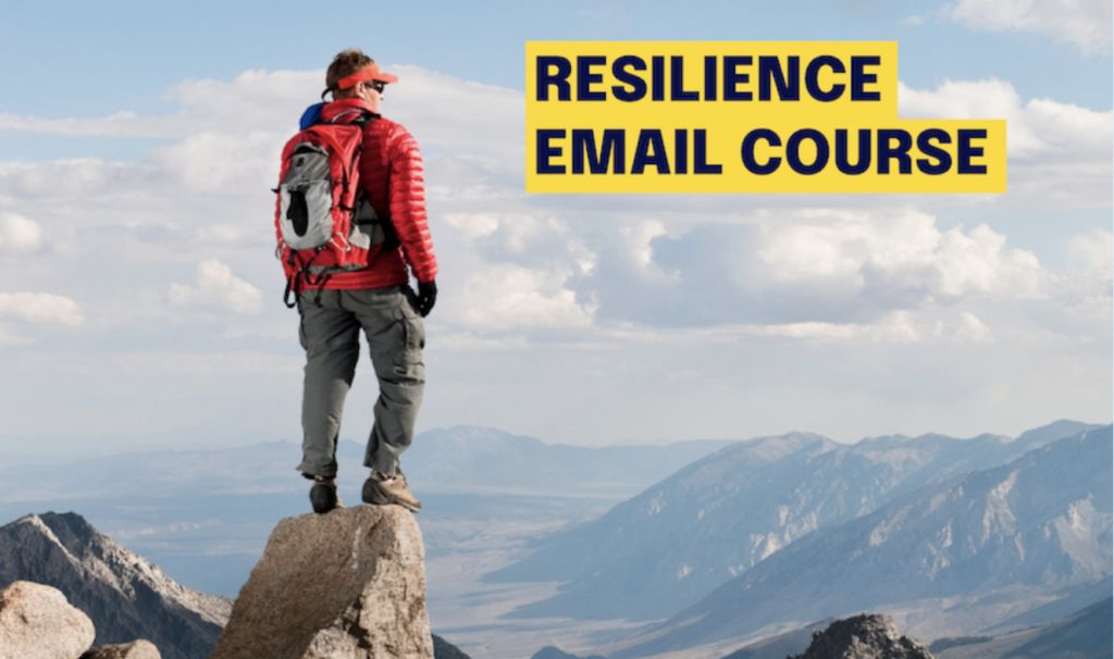 A person in hiking attire stands on top of a mountain and looks into the distance. The words "Resilience Email Course" are beside them. 