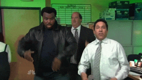 gif from the TV show "The Office" with three men dancing in a an office with lights flashing