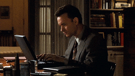 GIF of Tom Hanks typing on a laptop, looking frustrated. 