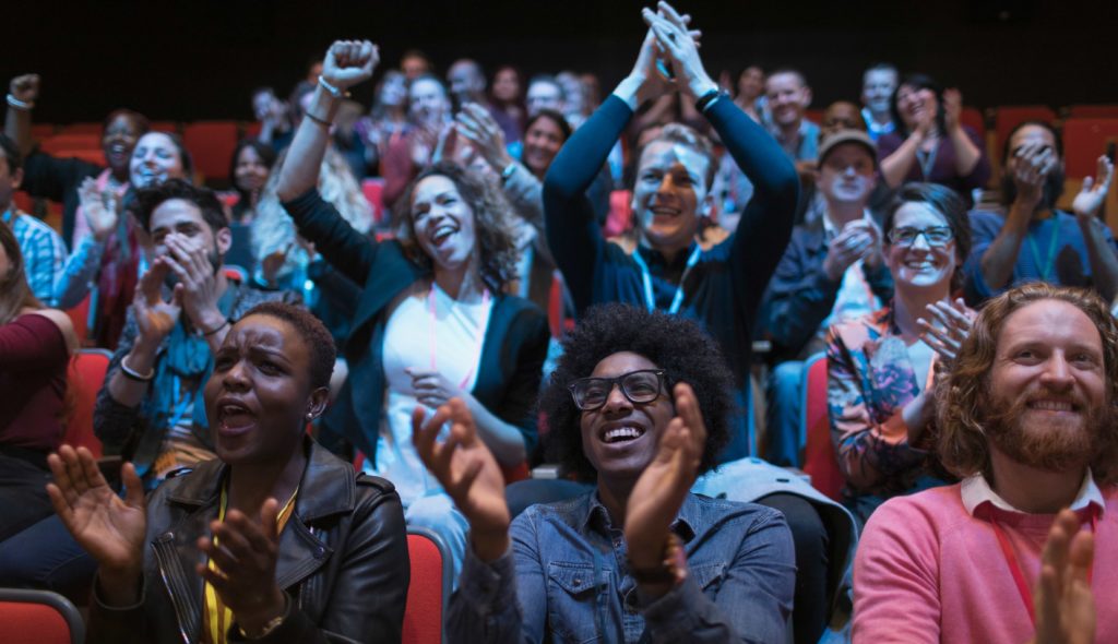 Happy employees cheering success