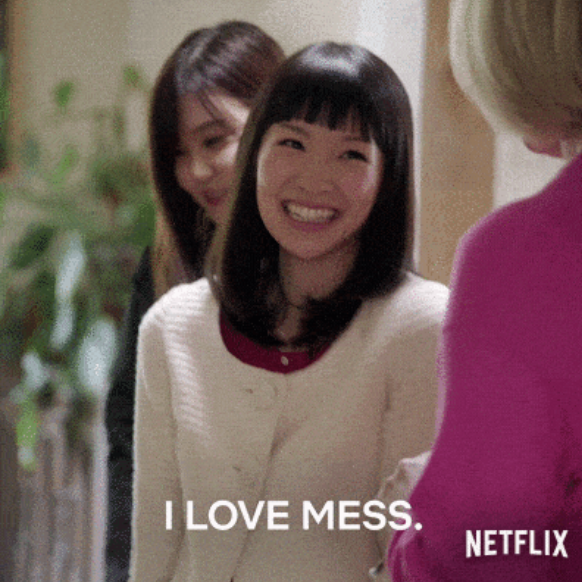 Marie Kondo, organizing consultant, stands in front of clients and says "I love mess."