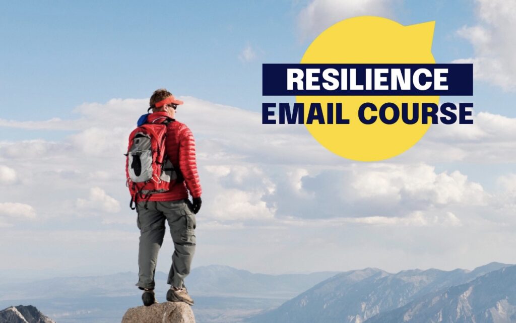 A person in hiking attire stands on top of a mountain and looks into the distance. The words "Resilience Email Course" are beside them. 