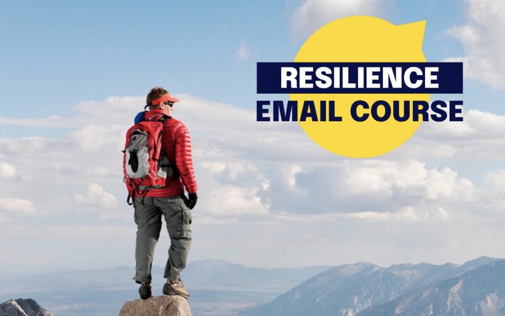 A person in hiking attire stands on top of a mountain and looks into the distance. The words "Resilience Email Course" are beside them.