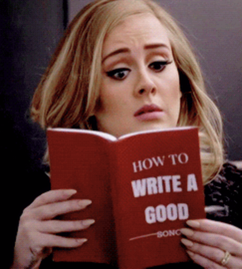 A woman reads a book about how to write well